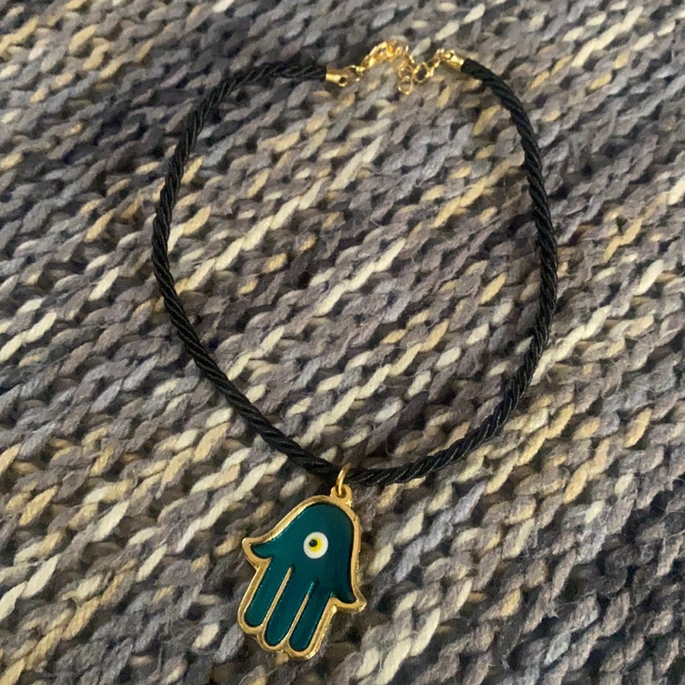 Hamsa Protective Symbol Hangs From Review Mirror